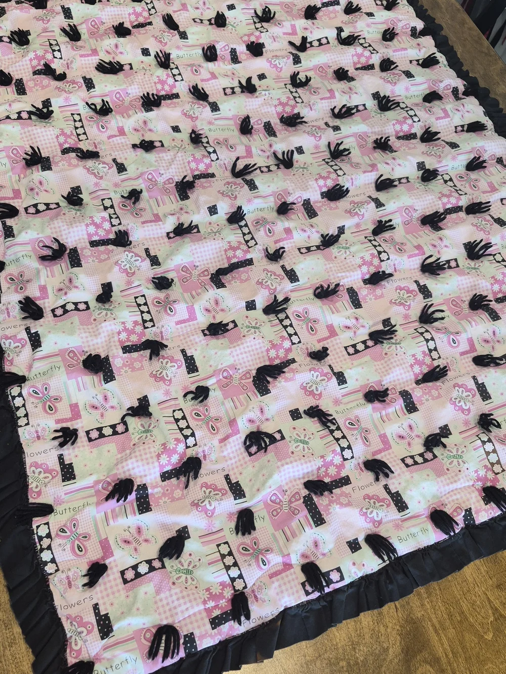 Handmade Pink Butterfly Tie-Knot Patchwork Baby Quilt with Black Ruffled Edge